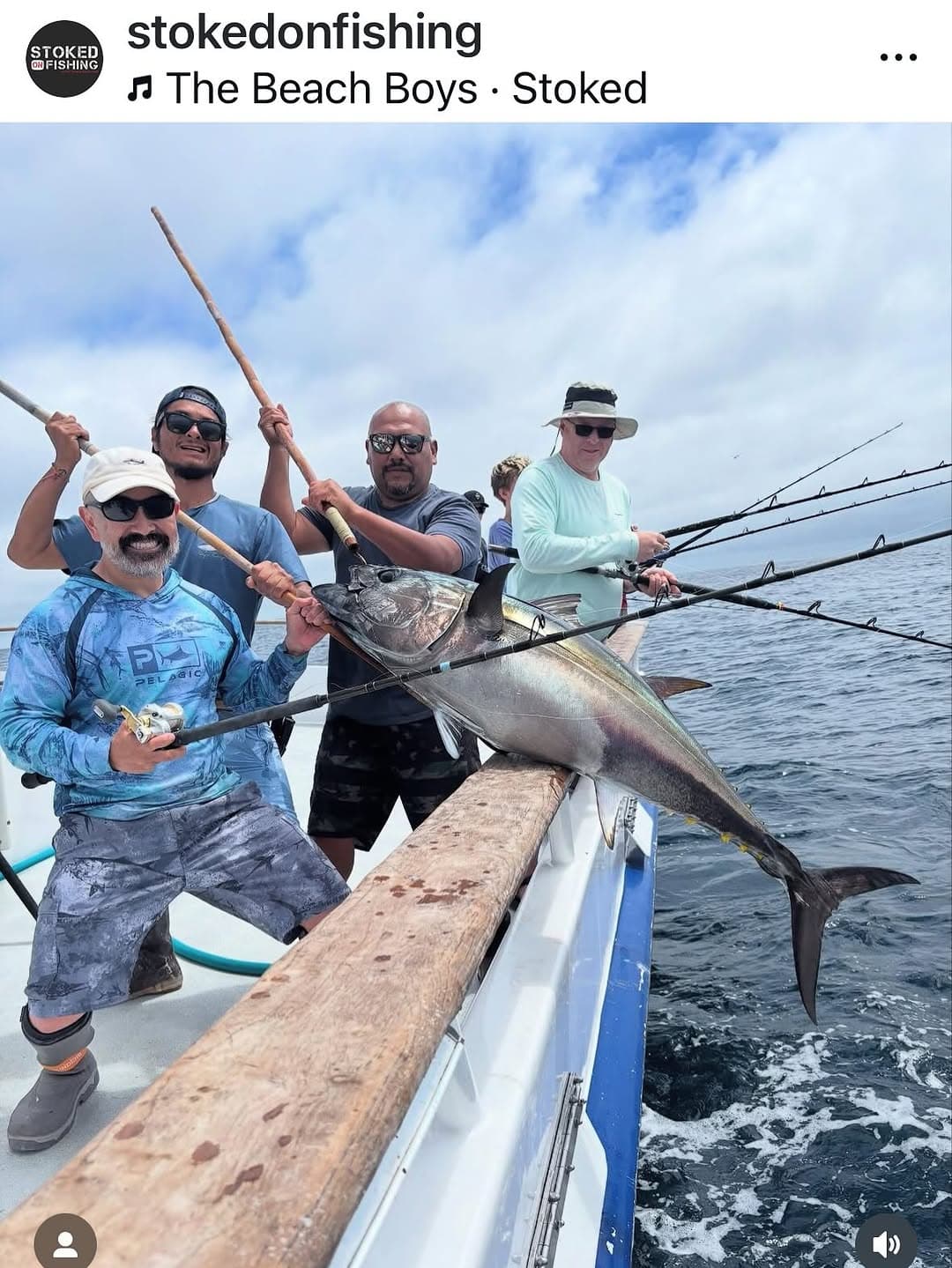 Group of anglers standing over a huge billfish on the deck